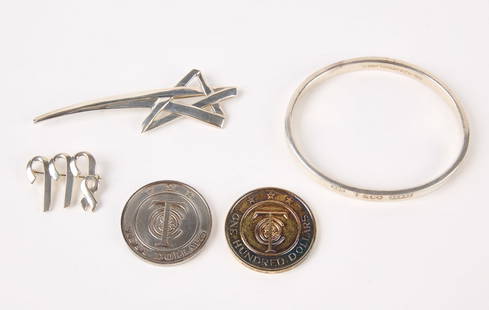 Silver Tiffany Jewelry and Tokens: Silver Tiffany jewelry and coins (or Tiffany money). 1) Tiffany & Co. sterling silver bangle, marked on front of cove molded surround. Stamped 925 T&Co and the numbers 1837. Inside dated 1997. Circumf