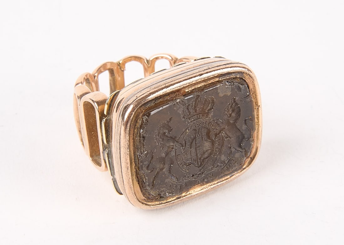 Gold and Quartz Intaglio Men's Ring: Gold and quartz intaglio wax seal mounted as a ring. 18.35 dwt. Condition: Edge roughness to seal. Size 6.1 Descriptions, weights, sizes and conditions are our best judgement and do not represent a gu
