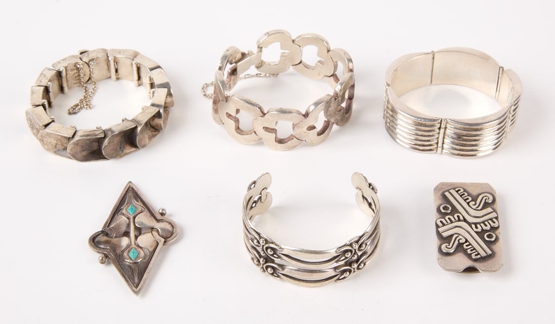 Six Taxco Jewelry Items: Six Taxco silver jewelry items. 1) Three link bracelets. 2) Cuff bracelet 3) Pin. 4) Money clip. All have marks. Range W 1-1/8" to 5/8" Total weight: 13.770 ozt. Descriptions, weights, sizes and condi