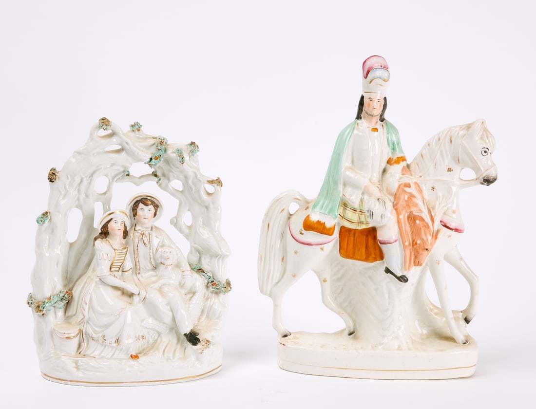 Two Staffordshire Figures: Two Staffordshire Figures. English. 19th century. Nobleman on horseback H 14-1/4" W 10-1/2". Courting couple with dog. H 11-1/2" W 9". Condition: Excellent with minor imperfections. Inspected under UV