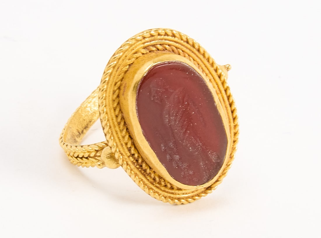 Lady's Ring: Early gold ring with carved carnelian. Acid tested 14K. 0.195 ozt. Ring Size 7-3/4. Condition: Excellent condition. Copy and paste link for high-res image: https://www.dropbox.com/sh/iuvg49o8foqvbzf/A