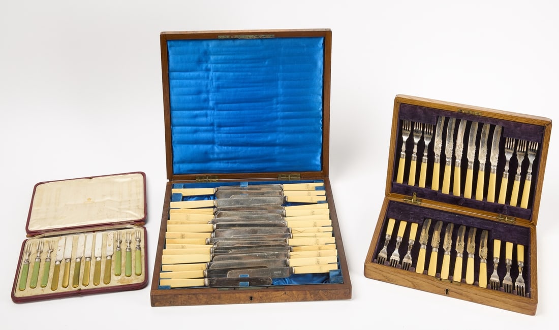 Three Boxed Knife and Fork Sets: Three boxed sets of knives and forks. Circa 1900, 1) Knife and fork set. Bone and silver. Marked 'JBC&SL'D EPNS' in original wood case. Twelve knives and twelve forks. Both have engraving. H 2-1/2" W 