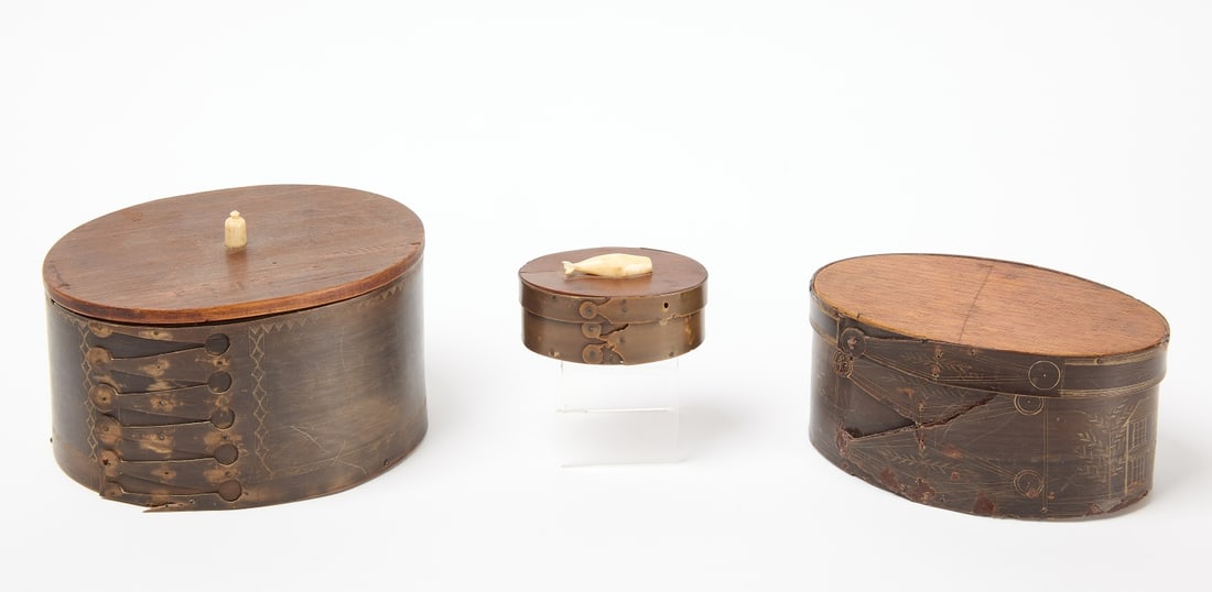 Three Scrimshaw Baleen Boxes: Three scrimshaw baleen boxes. Small box with applied bone carved whale. L 3-3/8". Medium box with scrimshaw incised town scene. L 6-1/4". Large box with bone finial and incised decoration. L 6-5/8". A