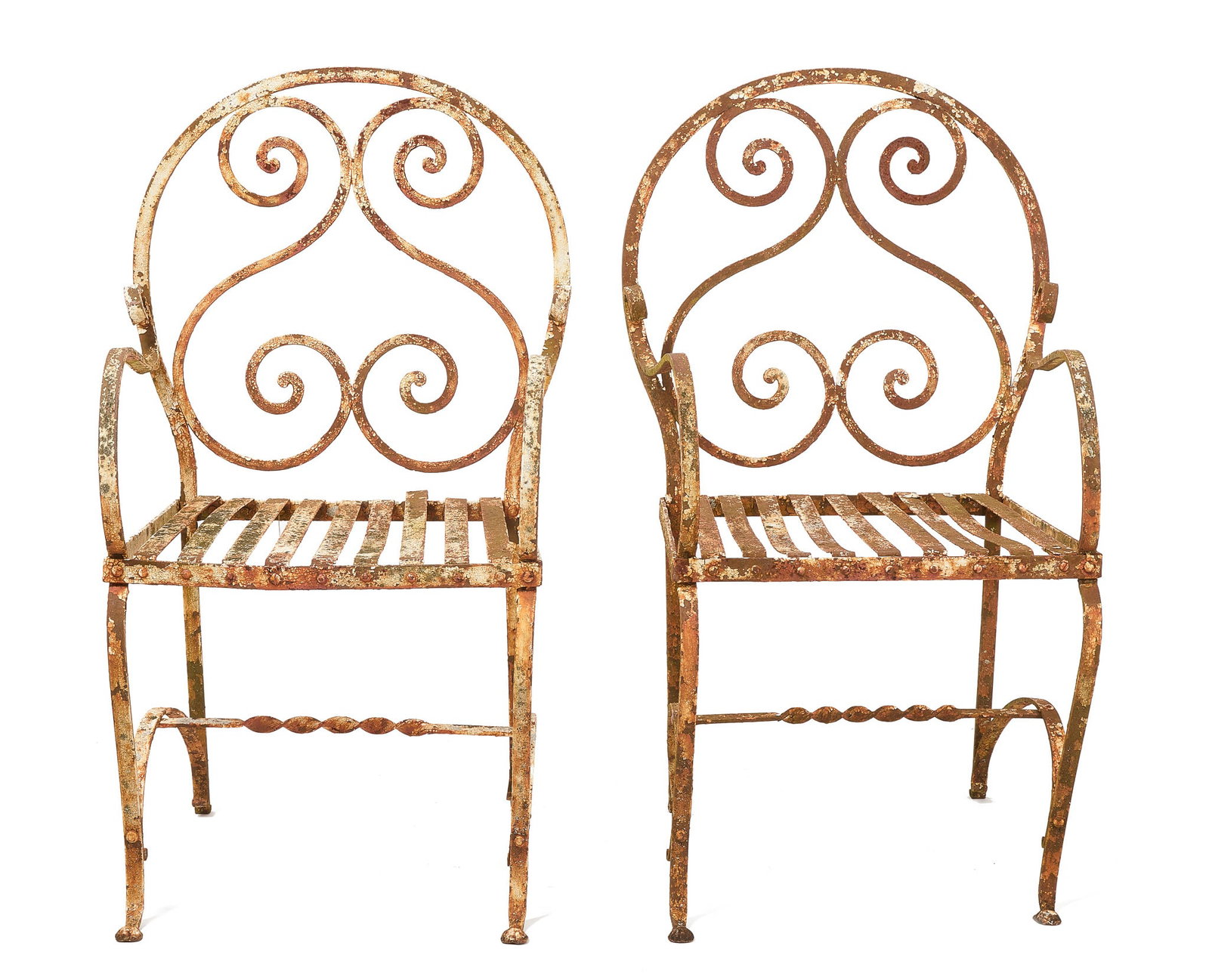 Pair of Iron Garden Chairs: Pair of iron garden chairs in old worn white paint. 19th century. H 36-1/2" W 20-1/2" D 21" Condition: Paint loss, rust and frames with slight bends. 