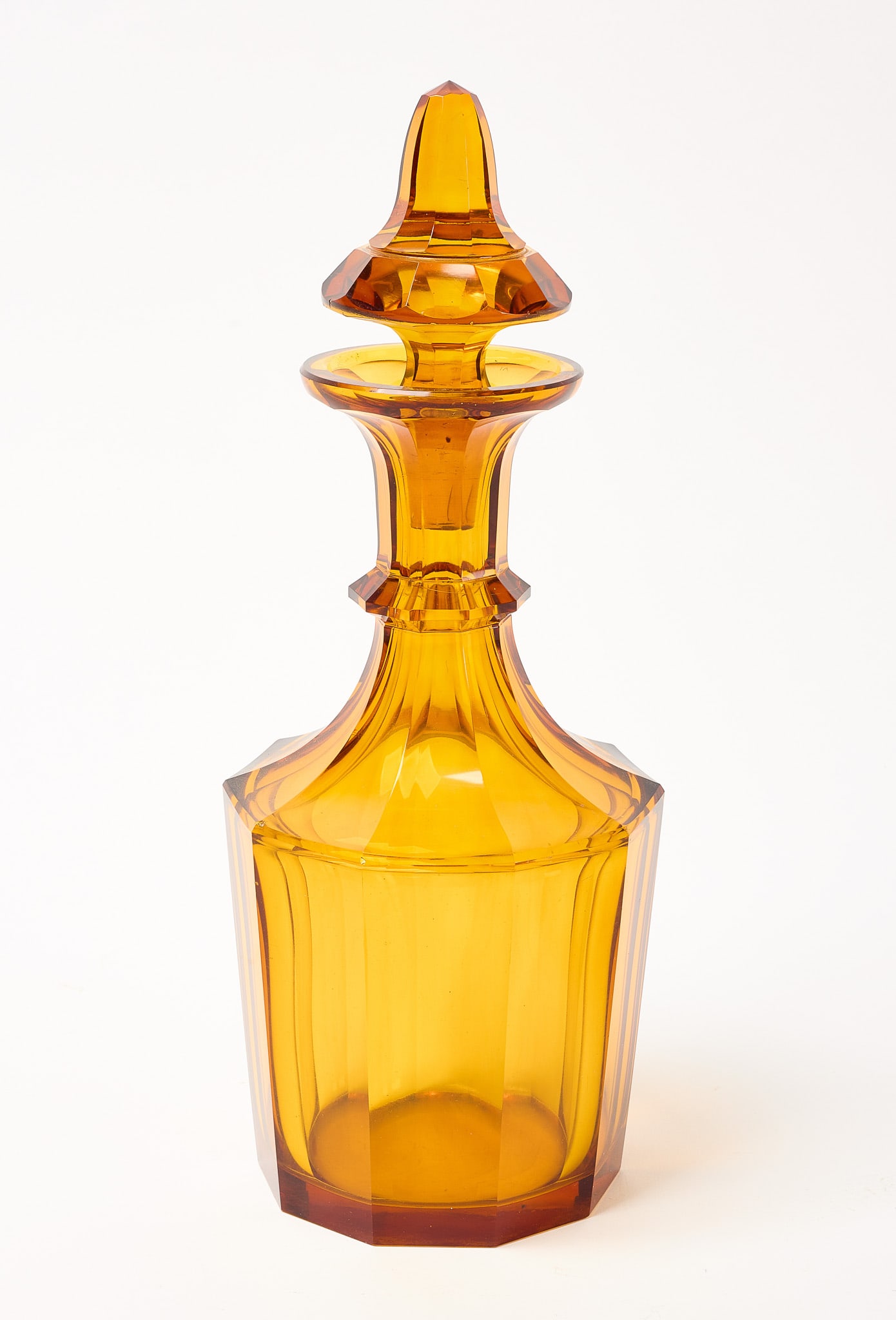 Amber Decanter: Amber glass decanter. Condition: Minute ding on mid-edge, barely detectable. H 11-3/4" 