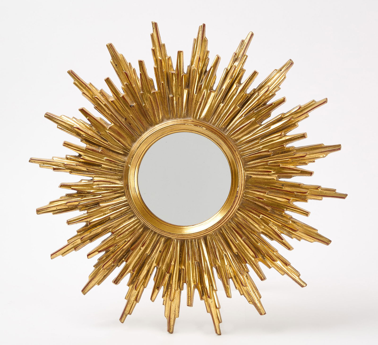 Wood Sunburst Mirror: Sunburst mirror. Carved and gilded wood. Circa 1970. D 19" Condition: Excellent.
