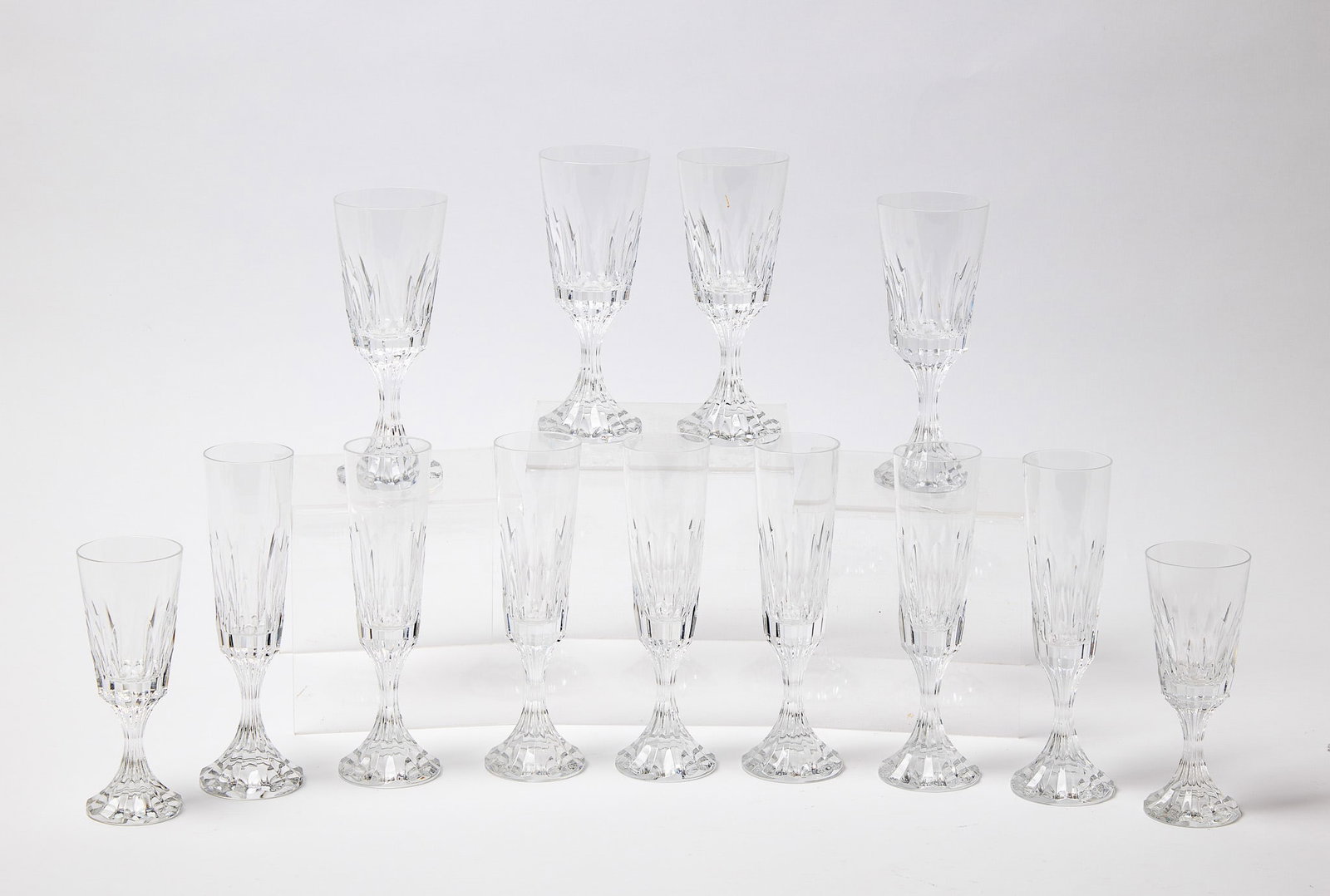 13 Baccarat Glasses: Thirteen Baccarat glasses. H 8-3/8" 7-5/8" 6-1/2" Condition: Excellent.