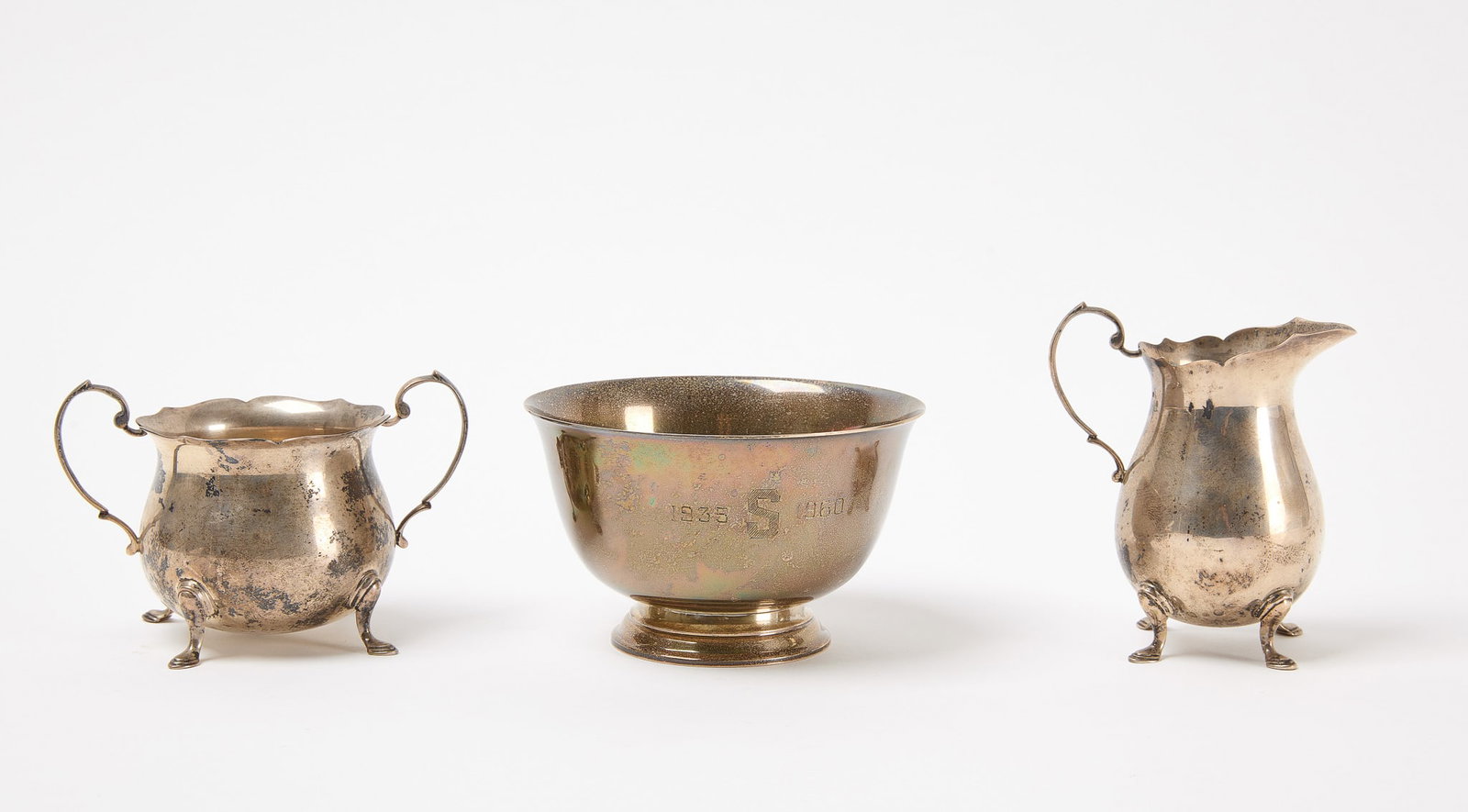 Sterling Tiffany Revere Bowl with Sugar and Creamer: A Tiffany Revere bowl. Together with a sugar and creamer. Sterling silver. Total weight: 17.975 ozt. Tiffany bowl: H 3-1/4" D 5" Sugar: H 3-1/4" D 3-1/2" Creamer: H 4-1/4" W 2