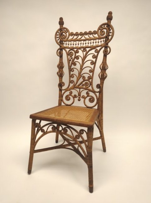 Wicker Chair: Wicker chair. Mid 20th century.H 43-7/8" W 17-1/4" D 19".Seat: H 16-1/2".Condition: Good vintage condition with no major damage or repairs noted. Wicker in some spots appears fragile but intact.