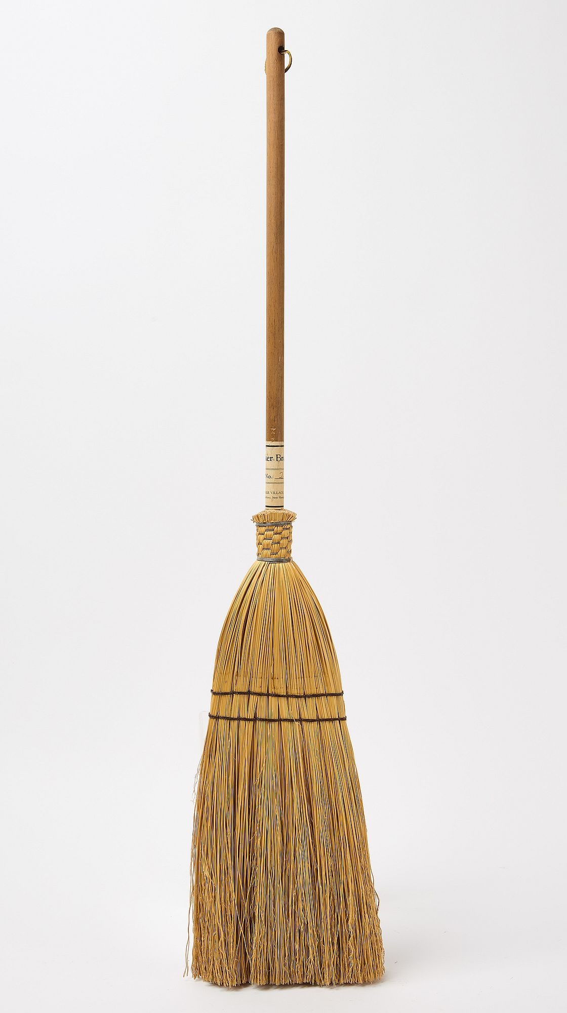 Shaker Broom: Shaker broom, No. 2. 'Shaker Village Inc.' label around shaft. New Hampshire. Broom: L 38" W 5-1/2". Condition: Excellent condition. Copy and paste link for high-res image
