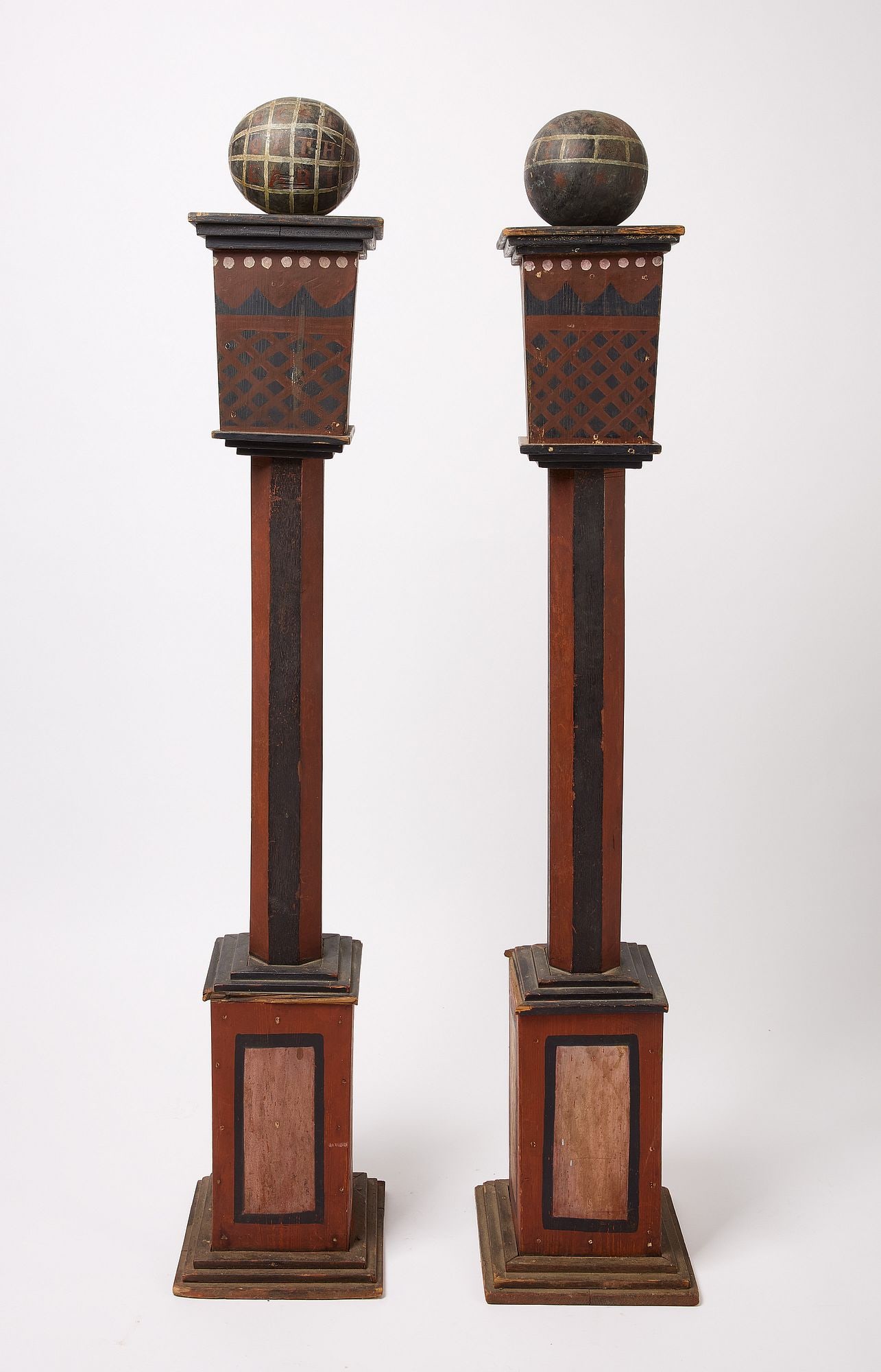 Pair of Fraternal Columns: Pair of primitive Fraternal columns. Carved and painted wood. American, circa 1900. H 67" W 12" D 12". Condition: Very good condition with minor to moderate surface wear. Some loss to t
