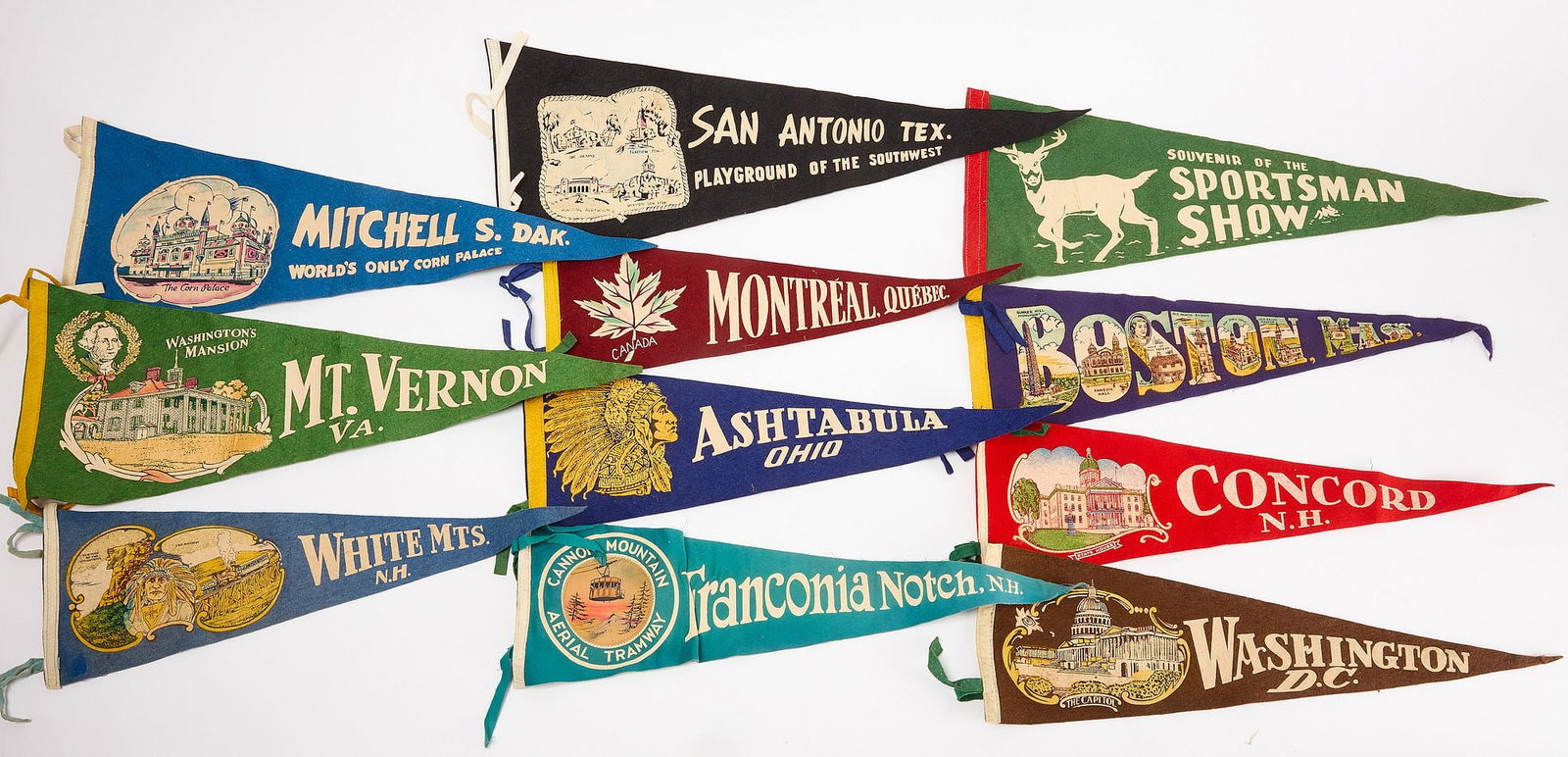 Group of 32 Felt Pennants Together with a Fez: Group of 32 felt pennants from various cities. Together with a fez embroidered 'LONGI'. Seven small: L 11-1/2" W 5". Large: L 26" W 8". Fez: H 6-1/2" D 10".