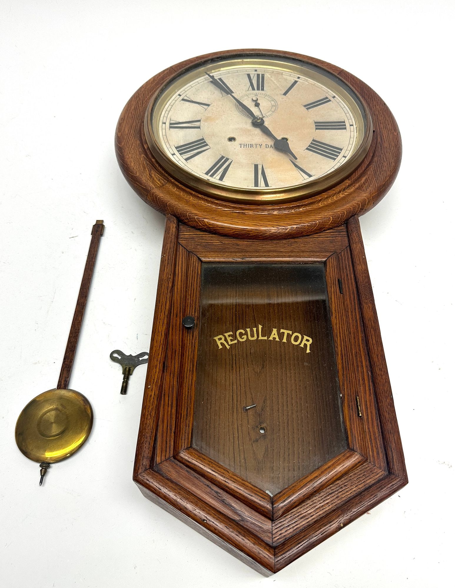 Regulator Wall Clock: Regulator wall clock. H 30-1/2" W 16-1/4" D 4-3/4". Condition: Excellent condition. 