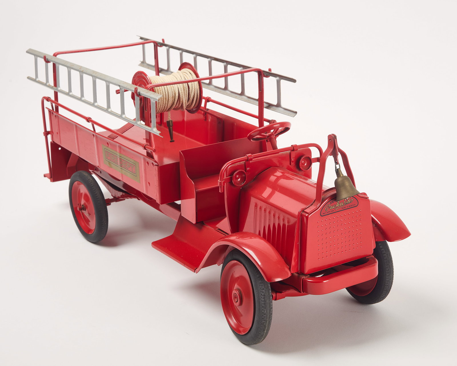 Keystone - Packard Fire Dept Truck: Keystone Mfg. Co. - Packard Fire Dept truck. Painted pressed steel. American, circa 1920. H 10-1/2" L 27-1/2" W 8". Condition: Possible historic repaint. Overall excellent condition wit