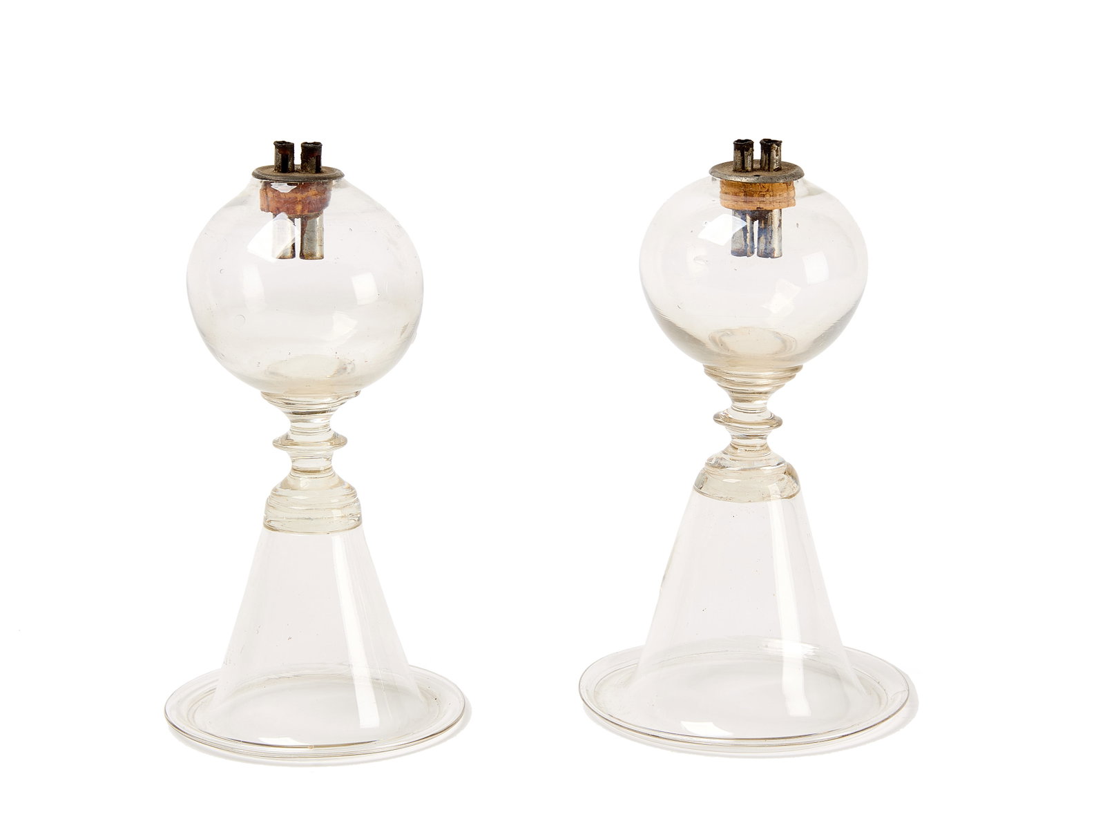 Pair of Blown Glass Oil Lamps: Pair of Sandwich blown glass petticoat whale oil lamps. New England, circa 1800. Provenance: Brian Cullity. H 8". Condition: Excellent condition. Link to hi-res images: https://www.dr