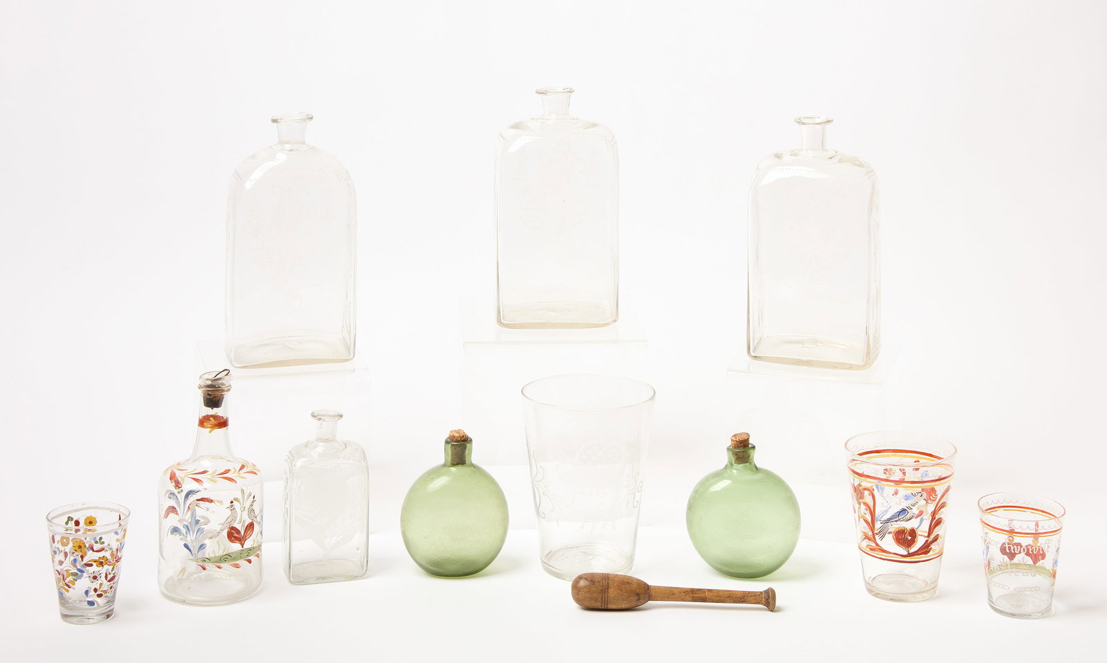 Blown Glass Flasks and Bavarian Painted Glass: Pair blown glass green pocket flasks, probably American, circa 1800. Three matching blown glass bottles with etched tulips. A small etched blown glass bottle and an etched flip glass. Together w