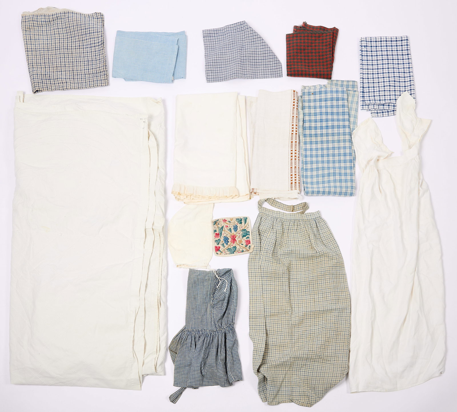 Group of Homespun Fabric - Clothing, Aprons: Fourteen pieces of homespun fabric, sheet and aprons. L 97-1/2" W 95. to L 6-1/2" W 6-1/2". Condition: Minor imperfections. Link for high-res images: https://www.dropbox.com/scl/fi