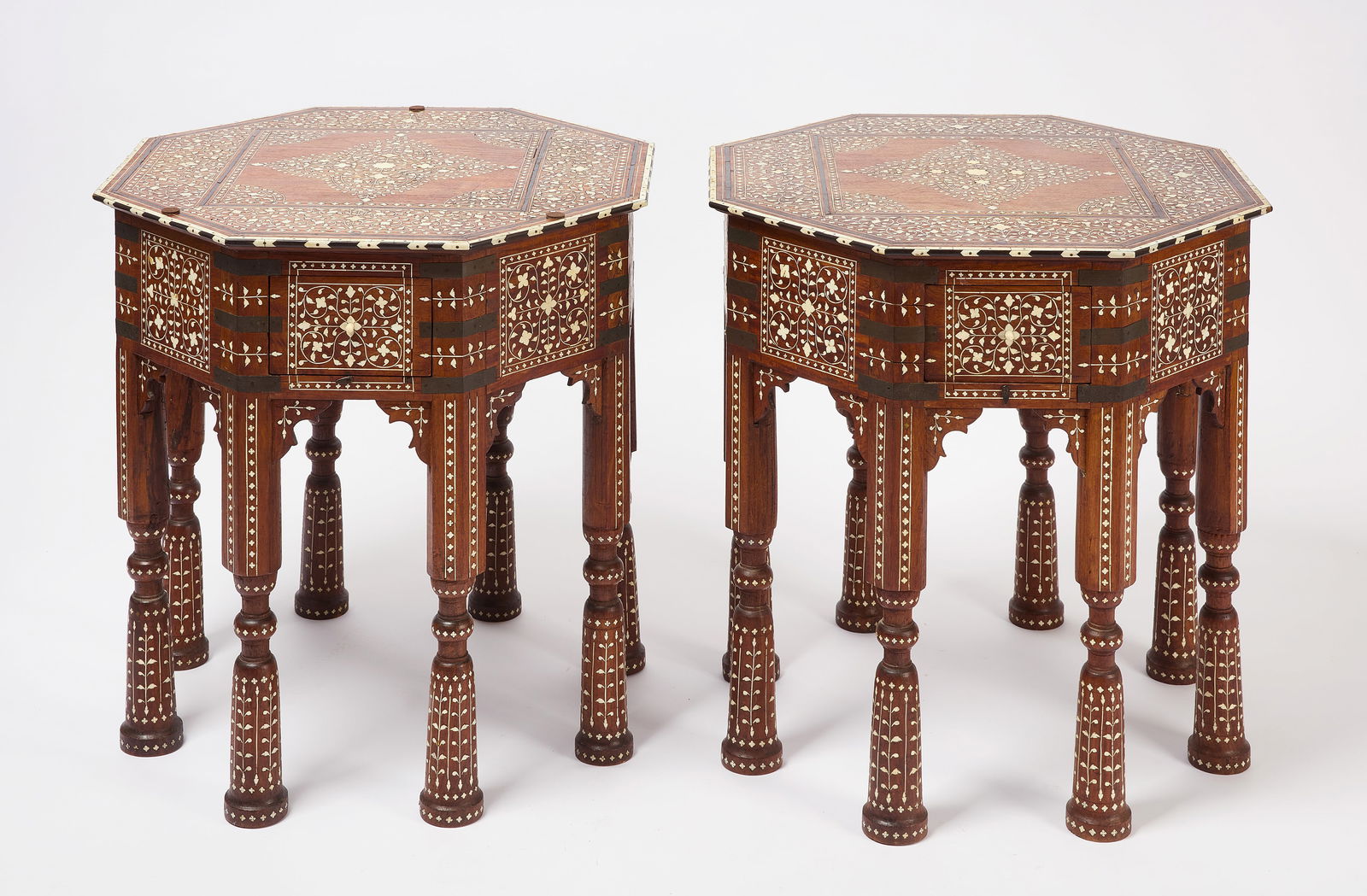 Pair of Octagonal Side Tables with Bone Inlay: Pair of octagonal side tables with bone inlay. Each with two drawers. Anglo-Indian. To corners: H 24" L 26" W 26". To edges: H 24" L 23-3/4" W 24-3/4". Condition: One bone handle broken on drawer. Lin
