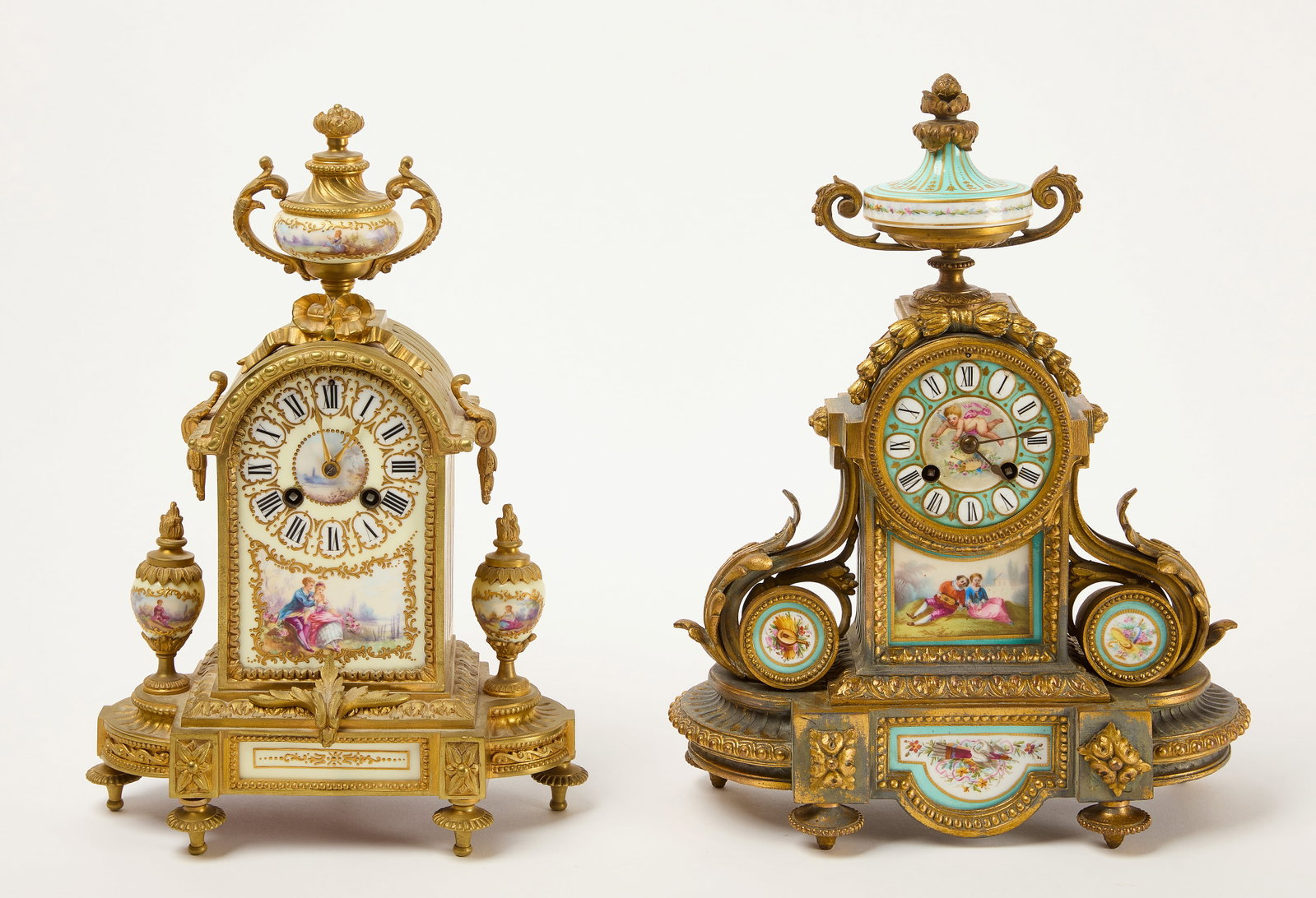 Two Brass Mounted with Porcelain Fitted Clocks: The first by Phillipe H.Mourey (1840–1910). Brass mounted and porcelain fitted clock with gilding. Together with a brass mounted and porcelain fitted clock. H 14" W 11&