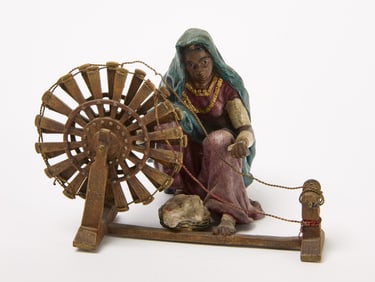 Figure of a Woman with Spinning Wheel