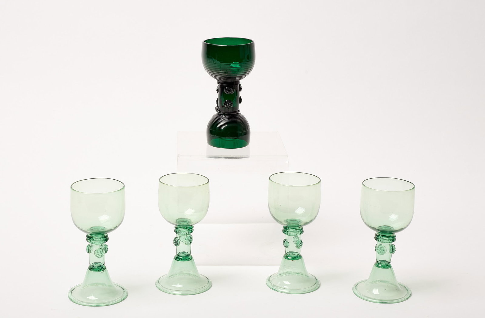 Fine Roemer Wine Glasses: Fine Roemer wine glasses with prunts. Including a rare dark green example with applied prunts. Together with four light green matching roemers with applied prunts. Circa 1800.. Light green: H 5-1/2". 