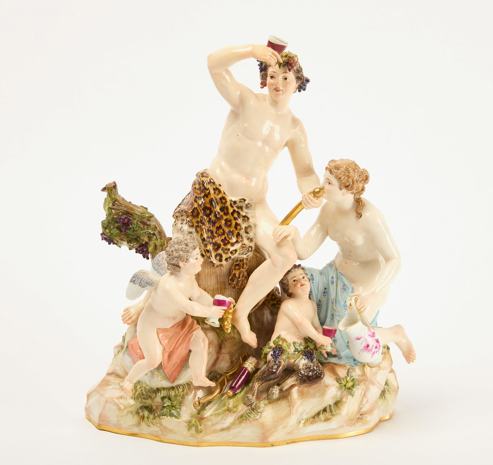Meissen Bacchus Porcelain Figural Group: Meissen figural group of Bacchus. Porcelain. With crossed swords mark in underglaze-blue, incised C35x. German, late 19th century. H 12-1/4" W 10" D 5". Condition: Minor losses and