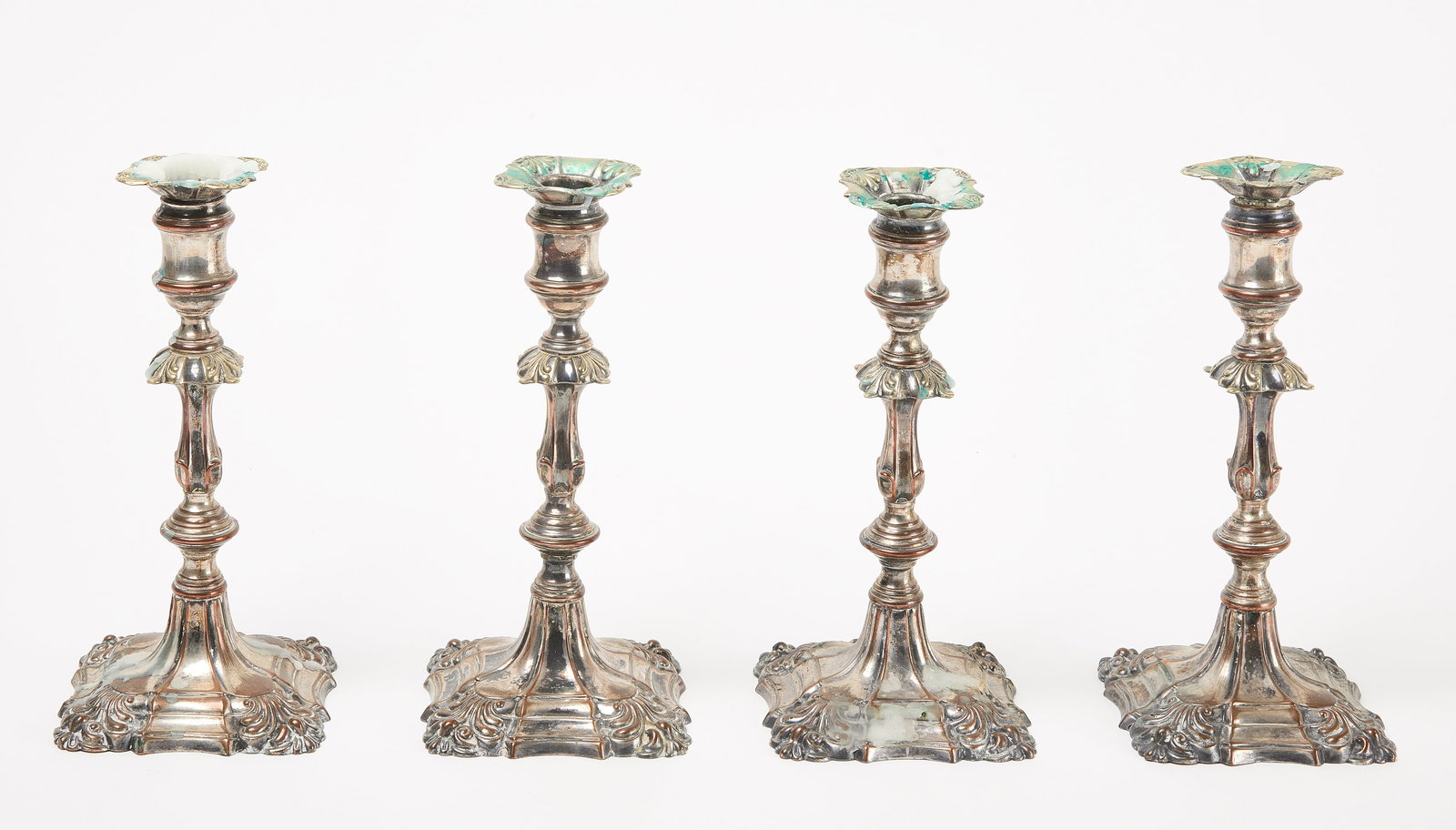 Four Matching Georgian Candlesticks: Four matching Georgian candlestick. Siver plate on copper. English, circa 1790. H 9". Condition: Age appropriate wear. Link to hi-res images: https://www.dropbox.com/scl/fo/2k4rd480kdqjl9ofjb9sn/