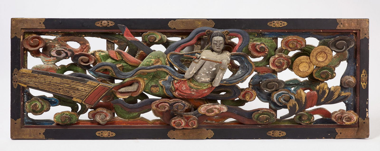 Japanese Buddist Carved Panel: Japanese Buddhist panel. Carved and painted wood with brass mountings. 19th century. Provenance: Hastings House Essex Ct. H 23-1/2" W 69-1/2". Condition: Minor imperfections. Loose segments