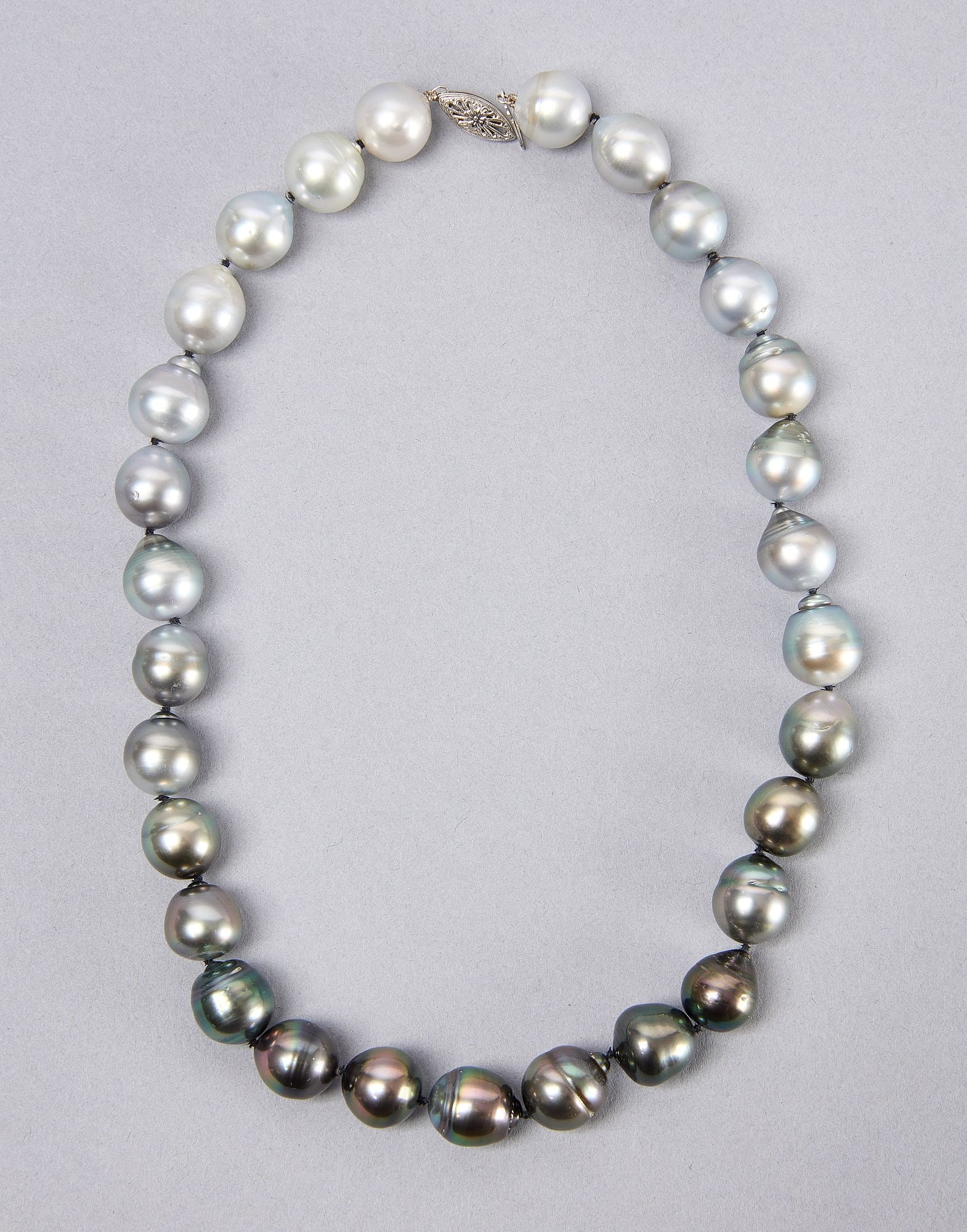 Baroque Tahitian Pearl Necklace: Baroque Tahitian pearl necklace, 3.0 to 14.0mm. 14kt clasp 14k white gold filigree fishhook clasp. L 19" Condition: Excellent condition. Link to hi-res images: https://www.dropbox.com/