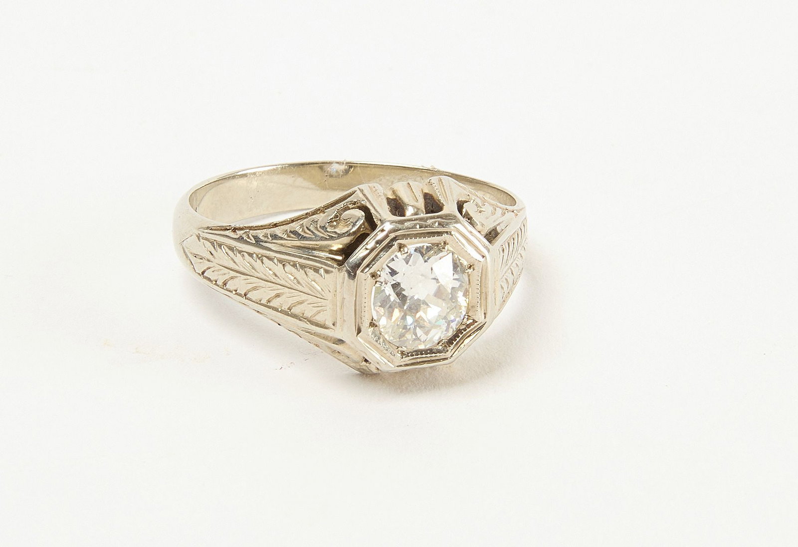 20k White Gold Diamond Filagree Ring: Diamond ring with intricate art deco styllized filagree octagonal setting of 20k white gold. Size 10. 6.4 x 6.0 x 3.43mm est 0.88ct G VS2 20kt 4.4dwt Condition: Excellent