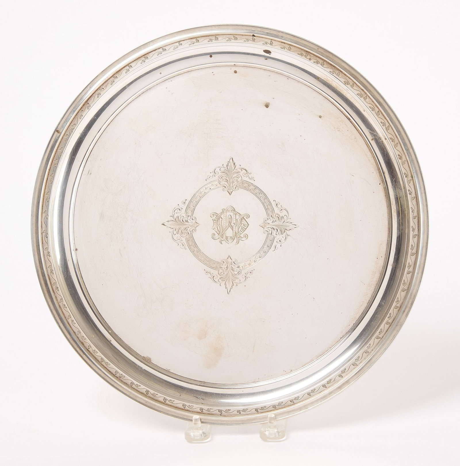 Sterling Monogrammed Salver: Sterling monogrammed salver. Hallmarked. 18.985 ozt. D 11-7/8". Condition: No imperfections noted. Link to hi-res images: https://www.dropbox.com/scl/fo/syicwqajjyhx60voj7if0/ADbhoDW61