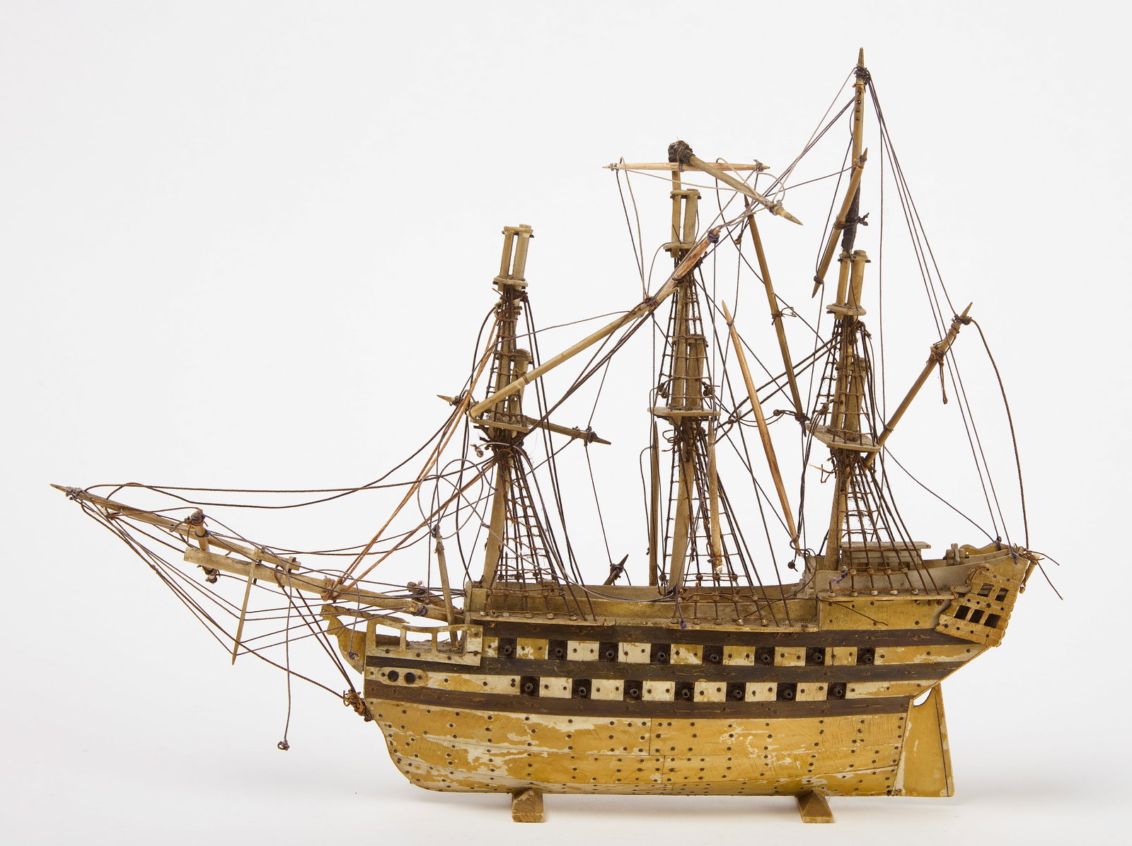 Clipper Ship Bone Model: Fine model of a clipper ship. Bone and baleen. American, 19th century. H 10-3/4" L Hull 10" D 2-1/8". Condition: Losses and imperfections. Link to hi-res images: https://www.dropbox.com