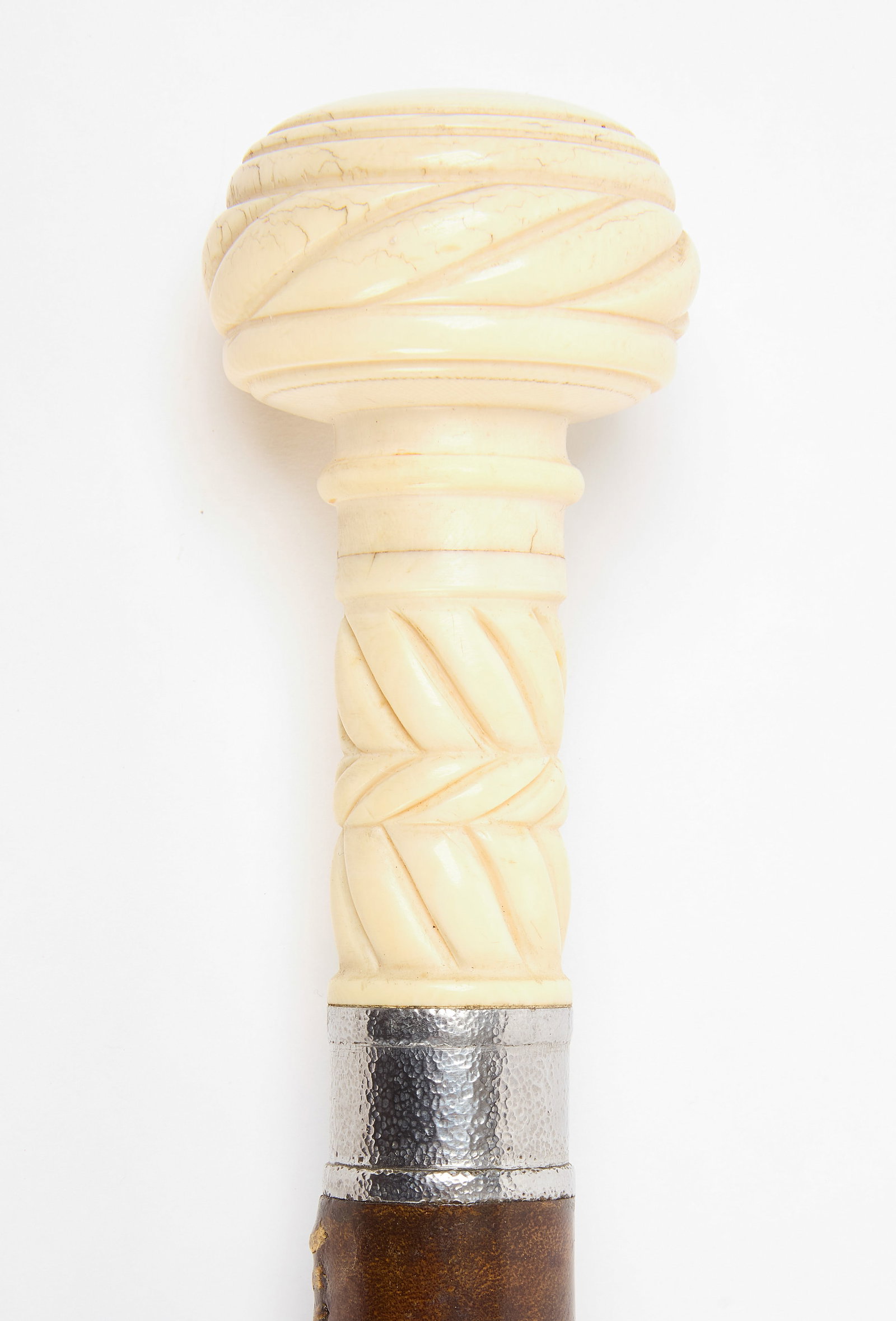 Walking Stick with Carved Scrimshaw Handle: Walking stick with carved scrimshaw handle. Leather wrap near top of stick. American, late 19th century. L 38-1/4". Condition: No damage noted. Link to hi-res images: https://www.dropbox.com/scl/