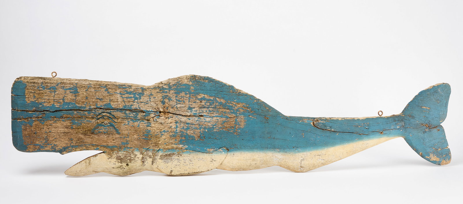 Whale-Form Sign: Whale-form sign. Double sided painted wood. Original iron hanging hooks. American, circa 1940. H 13-1/2" L 59-1/2". Condition: Moderate surface wear and paint loss. Structurally solid. Link 