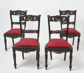 Set of Four Carved Ebony Neoclassical Side Chairs