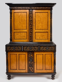 A Colonial Anglo-Indian Market Ebonized and Solid Satinwood Two-Part Cabinet