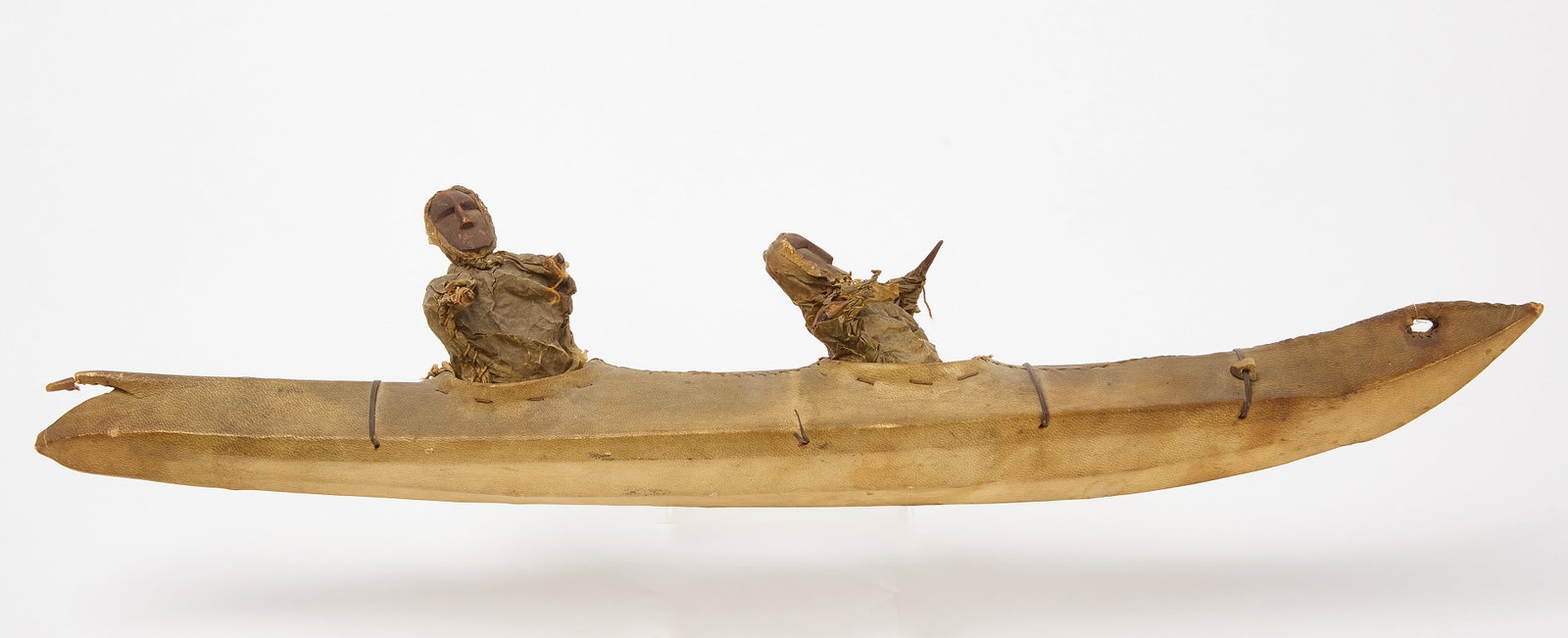 Alleut Eskimo Kayak Model: Alleut Eskimo Kayak Model. Carved wood with pigment, bone, hide and skin. Circa 1850-90. L 22". Collection of Jeffery Myers. Condition: Minor imperfections and losses. Link to high-res imag
