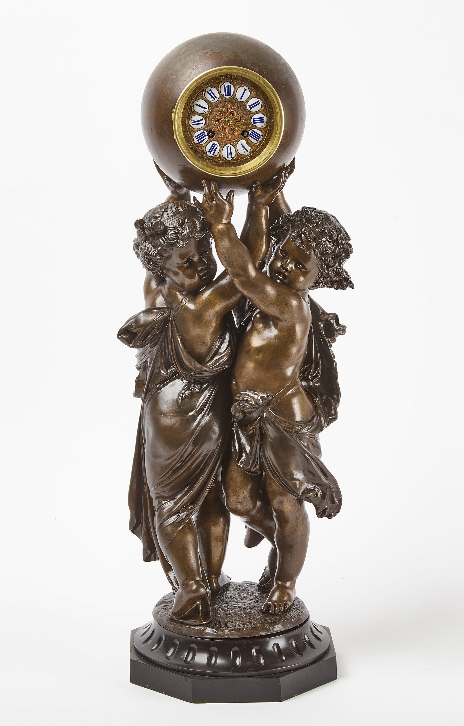 A. Carrier - Bronze Pedestal Clock: Bronze pedestal clock showing two cherubim holding up a sphere with clock inside. Signed 'A. Carrier' on figure base. France, late 19th century. H 27". Condition: Untested. Wear and losse