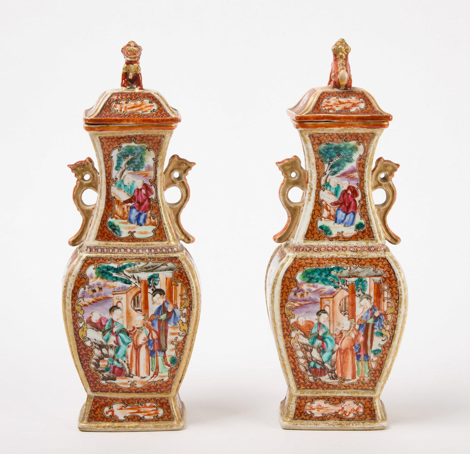 Pair of 18th Century Chinese Porcelain Garniture Vases: Pair of 18th Century Chinese Porcelain Garniture Vases. Foo Dog finials. H 12-5/8". Condition:Both lids have restoration. One with repaired corner and one with finial reattached. Minor surface imperfe