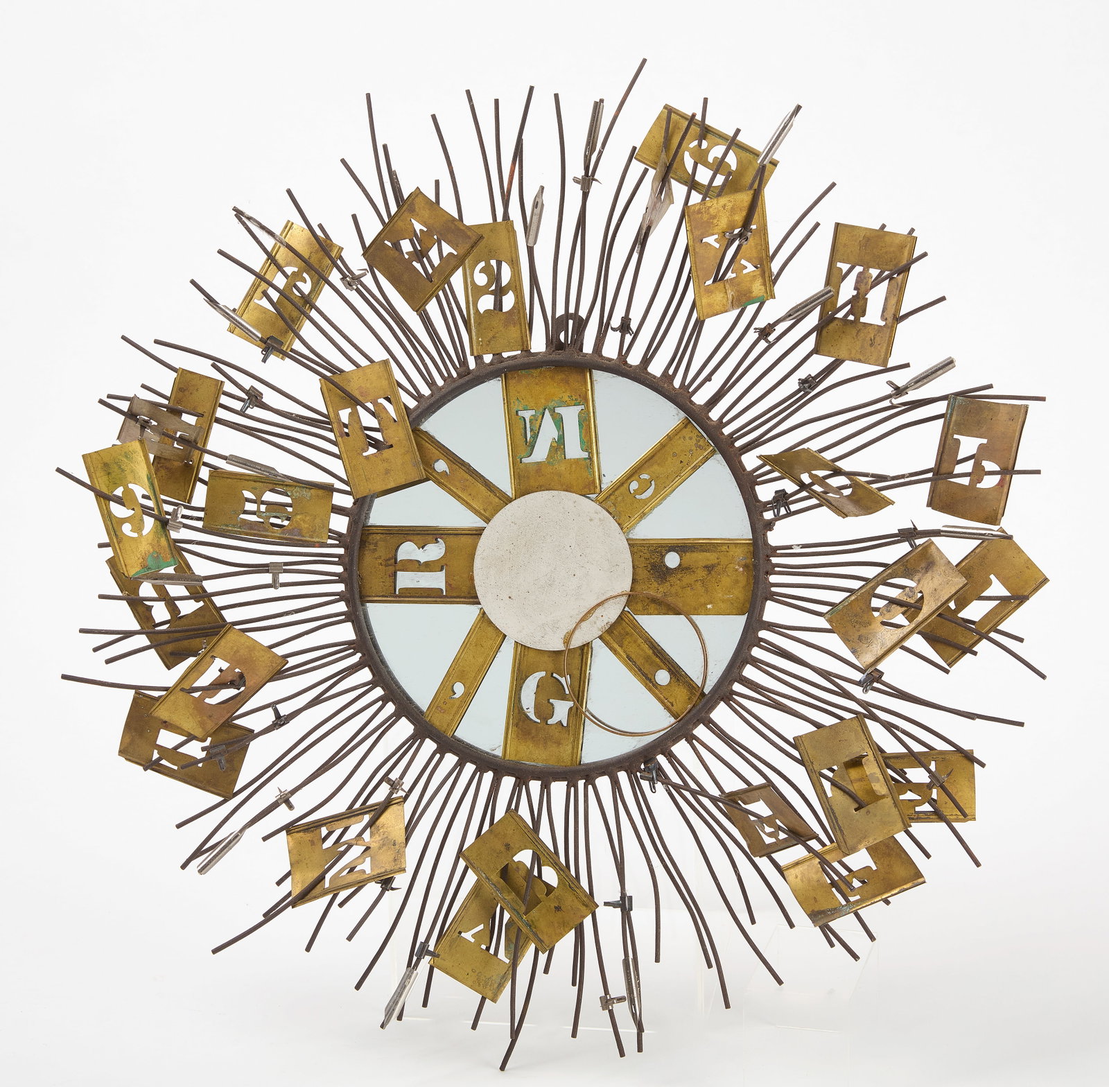 Sunburst Wall Sculpture: Sunburst wall sculpture featuring an assemblage of brass stencils. Circa 1970. D 20 in. Condition: No damage noted. Link for high-res images: https://www.dropbox.com/scl/fo/8hcos8ya5tsoutdapc9uu