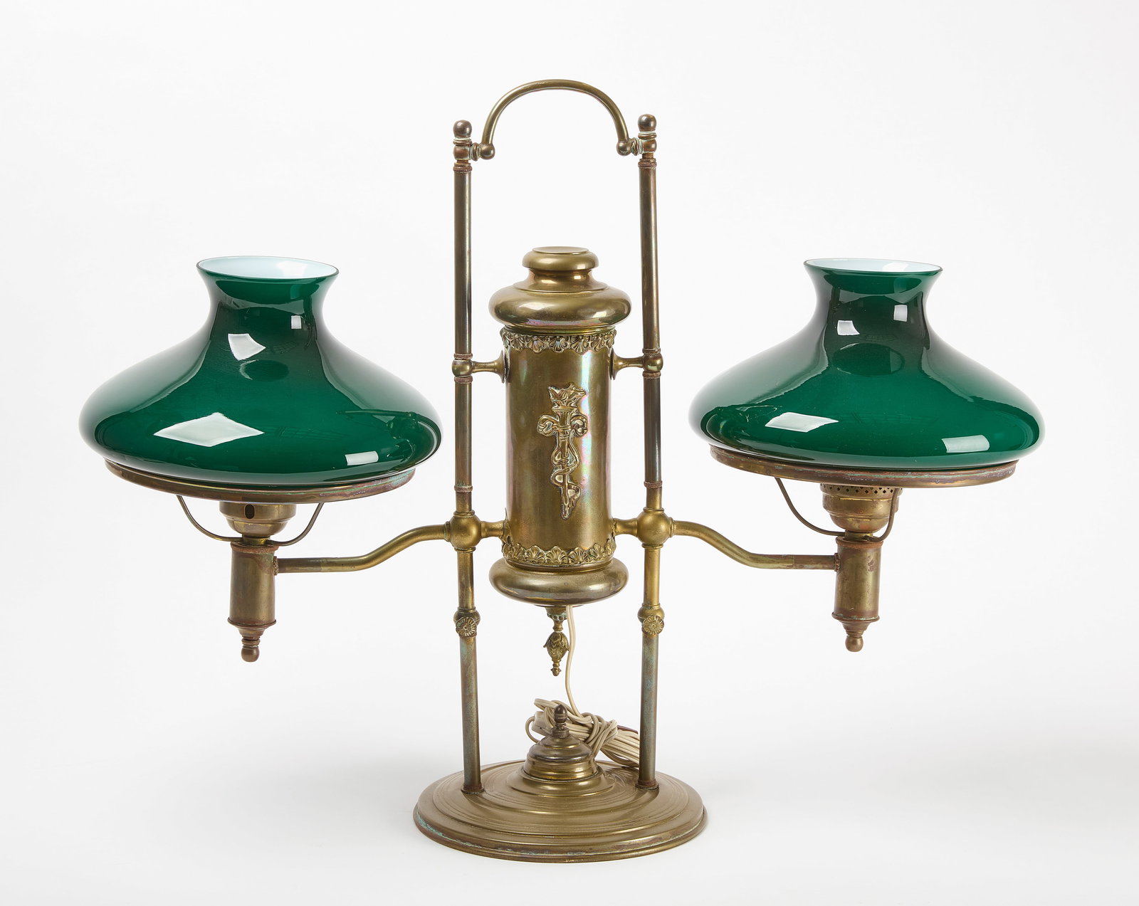 Double Student Lamp: Double student lamp. Brass body with green milk glass shades. H 25 in. W 32 in. Condition: No damage noted. Link for high-res images: https://www.dropbox.com/scl/fo/6bea4psl4827yvilq7