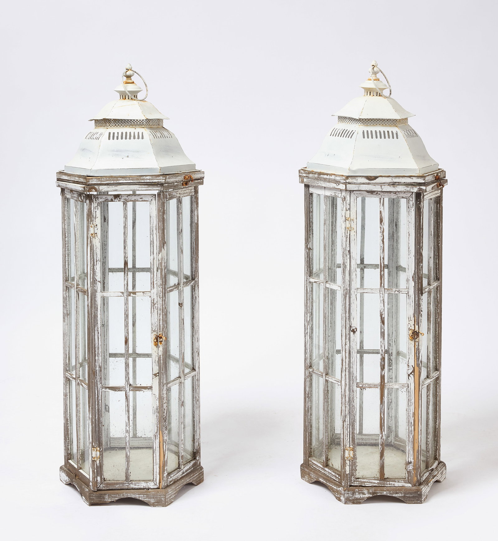 Pair of Tall Hanging Terrariums: Pair of tall hanging terrariums. Metal roofs with wood and glass. Top is hinged as well as a hinged door on each. Circa 1960. H 41-1/4 in. D 13 in. Condition: Pleasing weathered condi