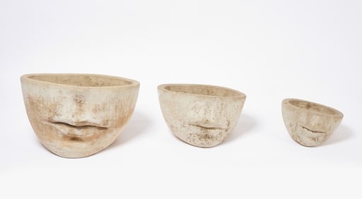 Three Cast Stone Face Planters