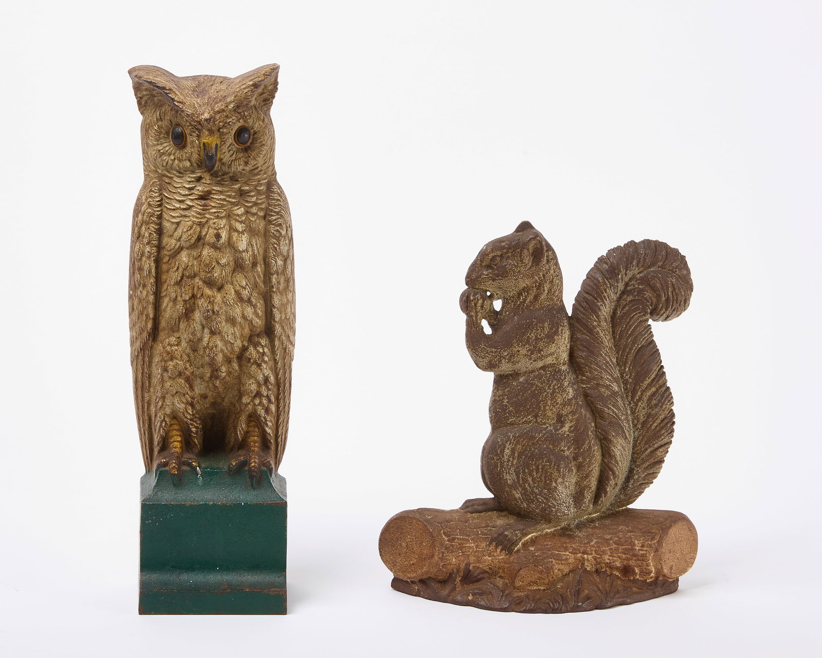 Owl and Squirrel Doorstops: Two painted door stops. Cast iron. One a squirrel, together with an owl stamped B&H (Bradley and Hubbard). Each with original paint. Squirrel: H 11-1/4 in. W 9-3/4 in. Owl: H 16 in. W 4
