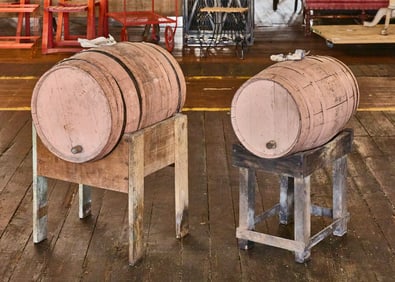 Two Painted Casks on Stands