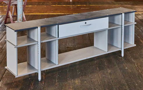 Low Modern Shelf: Low metal shelf with wod sides. Original finish. H 24 in. W 73-1/2 in. D 12-1/4 in. Condition: Very good with minor imperfections.