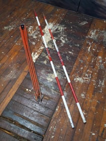 Two Surveyor's Poles and Tripod