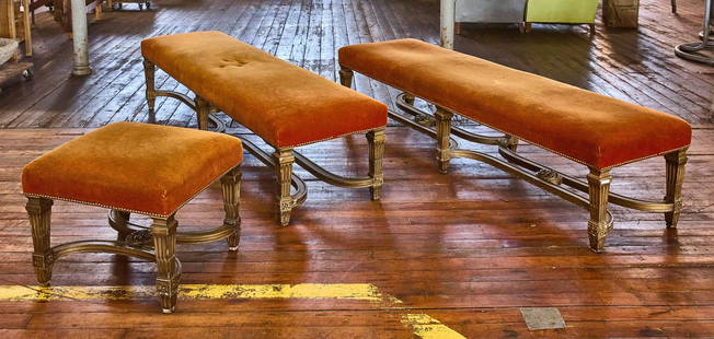 Pair of Vintage Benches with Ottoman: Pair of vintage benches and ottoman. Brass riveted. Faux painted gold wood frames. From a Newport Estate. Benches: L 76-1/2" D 22". Stool: W 22" D 23".