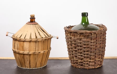 Two Blown Glass Cased Demijohn