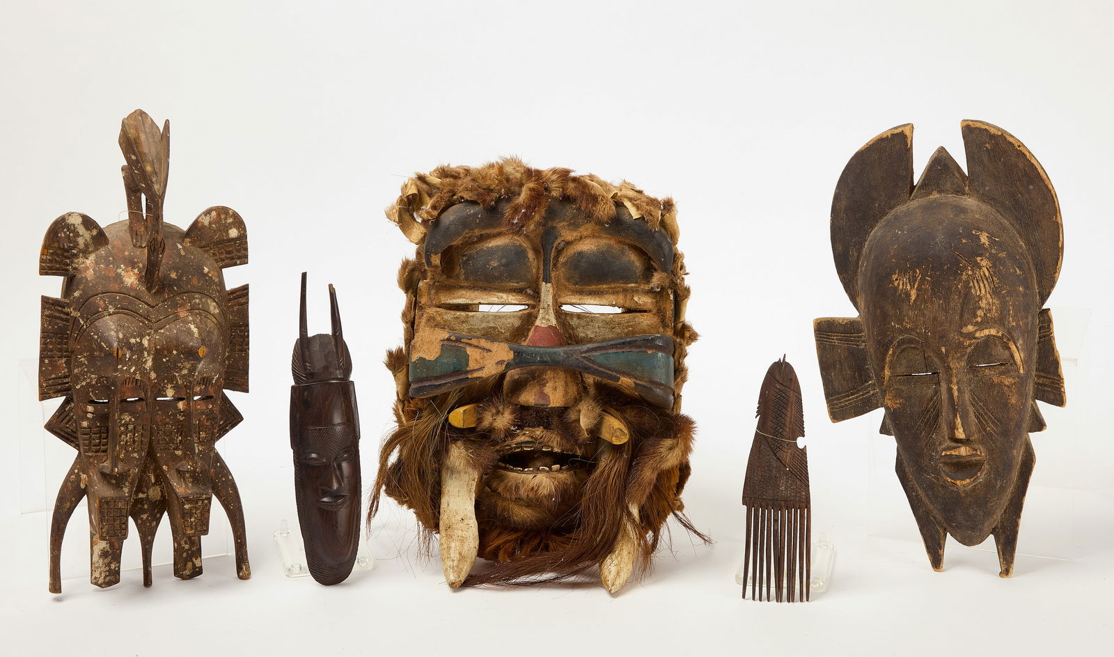 Four Carved Wooden African Masks and One Comb (1 of 5)
